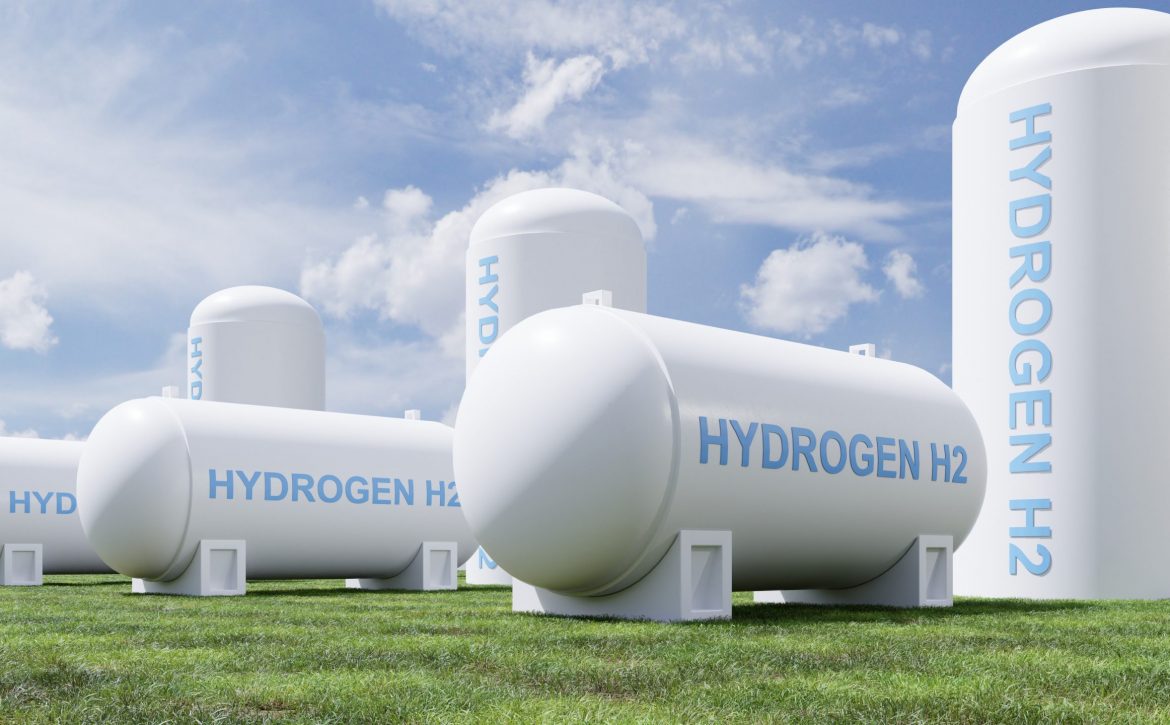 Hydrogen energy storage gas tank in meadow environment.